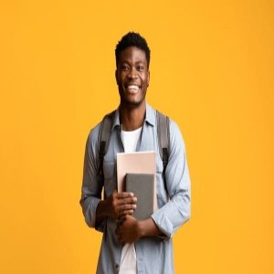 Young entrepreneur smiling against a warm background